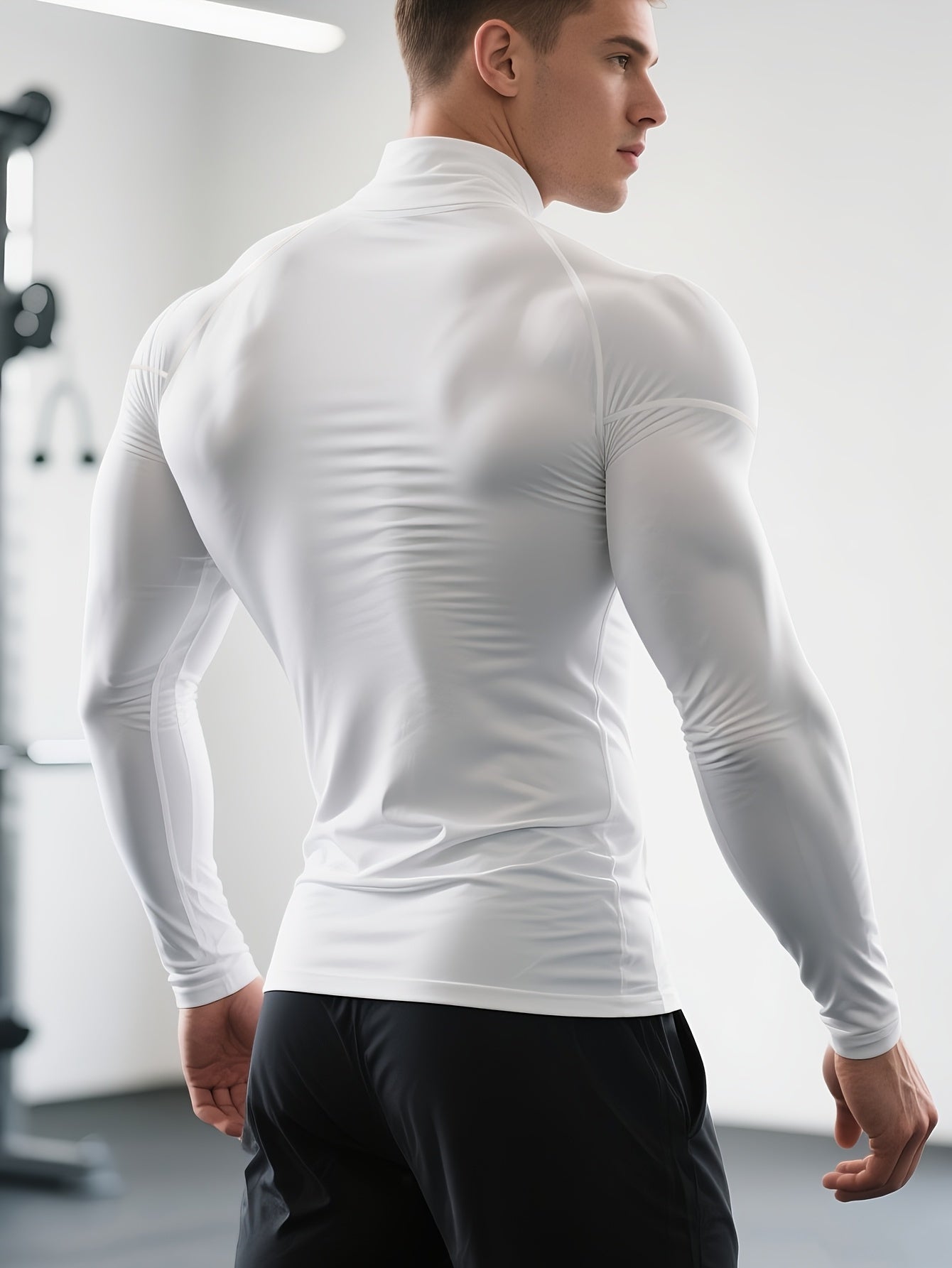 T-shirt de fitness homme à séchage rapide, col haut et manches longues, ajusté, parfait pour le gym, boxe et entraînements toute saison.