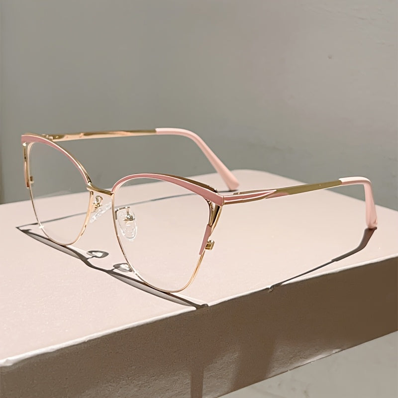 Paire de lunettes style œil de chat pour femmes, monture métallique légère, tendance rétro, couleur rose élégante, sans correction.