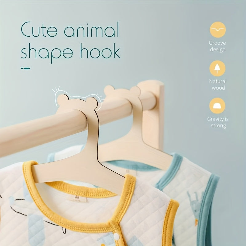 Lot de 20 cintres en bois forme ours, durables et polis, parfaits pour vêtements enfants, animaux et accessoires, décoration de chambre ou placard.