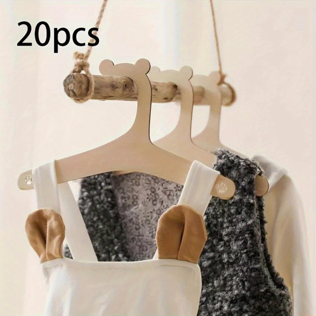 Lot de 20 cintres en bois forme ours, durables et polis, parfaits pour vêtements enfants, animaux et accessoires, décoration de chambre ou placard.