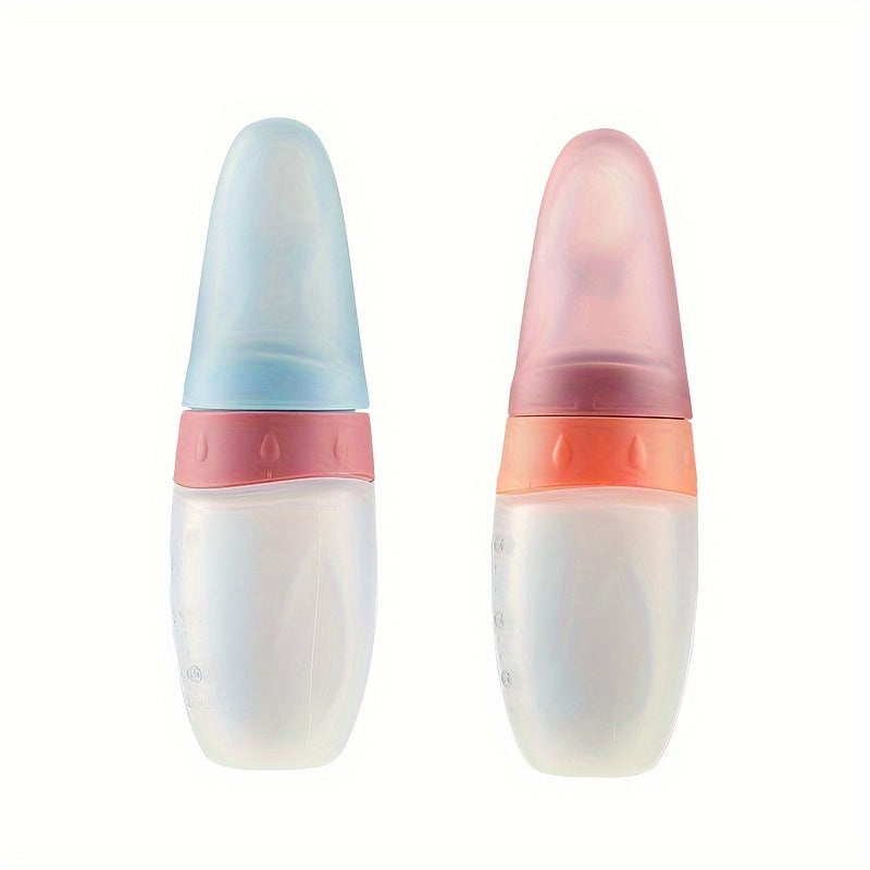 Biberon doseur 100 ml en silicone liquide, avec cuillère intégrée, idéal pour nourrir bébé avec pâte de riz ou aliments liquides.