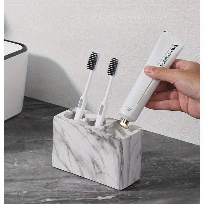 Porte-brosses à dents en résine 3 compartiments Design marbré avec touches dorées, rangement stable pour brosses et dentifrice, accessoire durable et élégant pour salle de bain.