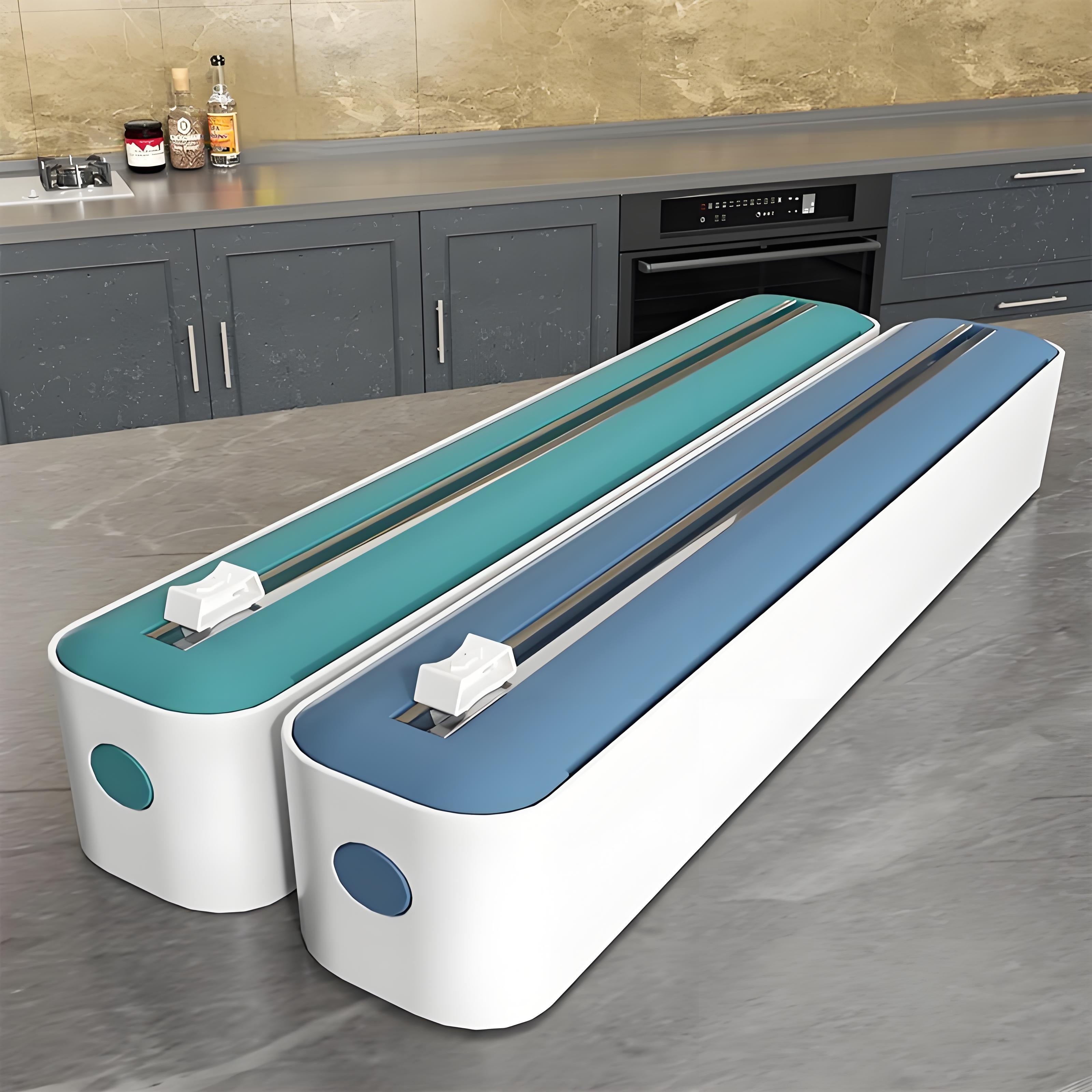 Distributeur et coupeur double action, réutilisable, pour film plastique, aluminium, papier cuisson et cire, design moderne blanc/noir avec accents orange.