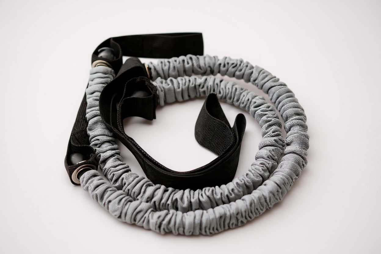 Bande de résistance pour rouleau abdominal, idéale pour les exercices de gainage et étirements avec roue abdominale.